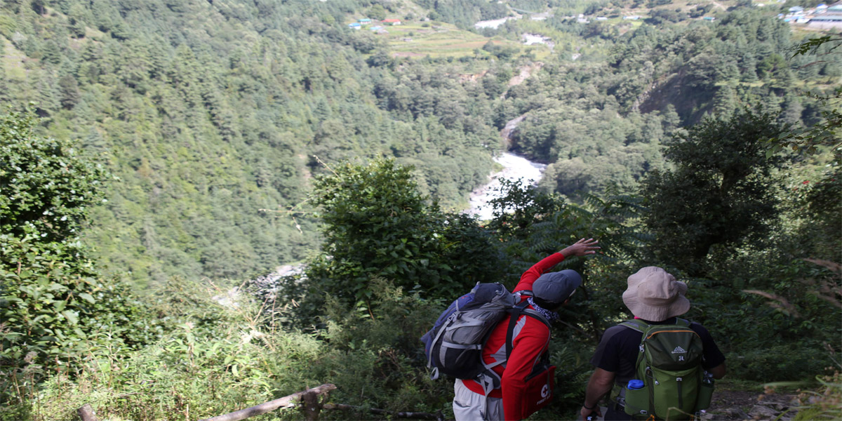 Trekkers looking at Phakding on Everest Base Camp Trail